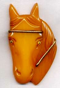 BP659 front facing butterscotch bakelite horse head pin